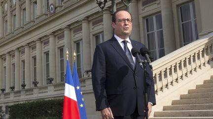 Le chef de l'Etat, Fran&ccedil;ois Hollande, le 26 juillet 2014,&nbsp;au minist&egrave;re des Affaires &eacute;trang&egrave;res, &agrave; Paris. (PHILIPPE WOJAZER / AFP)