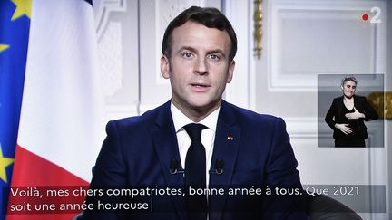 Capture d'écran lors des voeux d'Emmanuel Macron le 31 décembre 2020.&nbsp; (STEPHANE DE SAKUTIN / AFP)