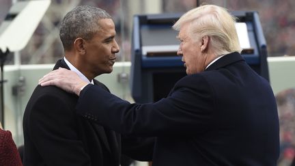 Barack Obama et Donald Trump lors de la passation de pouvoir à Washington (Etats-Unis), le 20 janvier 2017. (SAUL LOEB / AFP)