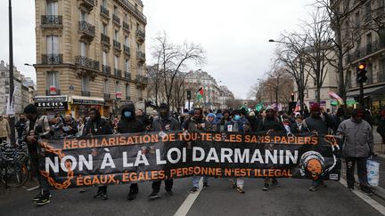 People demonstrate against the immigration law in Paris, February 3, 2024. (THOMAS SAMSON / AFP)