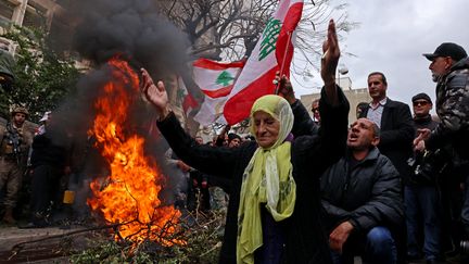 Demonstrators protest against the country's economic situation on March 30, 2023, in front of the central bank in Beirut, Lebanon.  (JOSEPH EID / AFP)