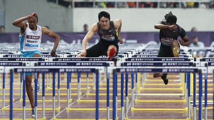 Le Chinois Liu Xiang en action sur le 110m haies