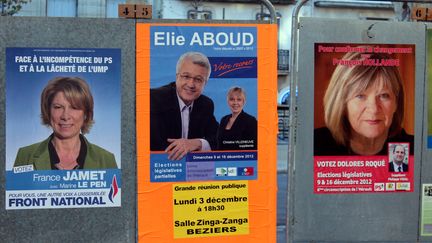 Les affiches de campagne des candidats FN, UMP et PS&nbsp;de la 6e circonscription de l'H&eacute;rault, &agrave; B&eacute;ziers, le 4 d&eacute;cembre 2012. (VIOLAINE JAUSSENT / FRANCETV INFO)