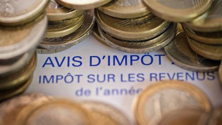 Les m&eacute;nages fran&ccedil;ais, essentiellement les plus ais&eacute;s, devraient contribuer &agrave; un effort de 10 milliards d'euros dans le budget 2013. (JOEL SAGET / AFP)