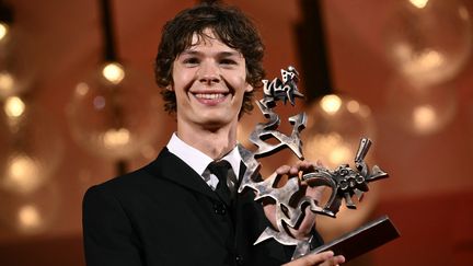 French actor Paul Kircher, 22, receives the Marcello Mastroinai Award for Best Emerging Actor at the Venice Film Festival for "Their children after them" by Zoran and Ludovic Boukherma, September 7, 2024. (MARCO BERTORELLO / AFP)