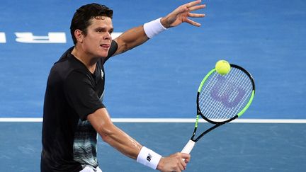 Milos Raonic au filet (SAEED KHAN / AFP)