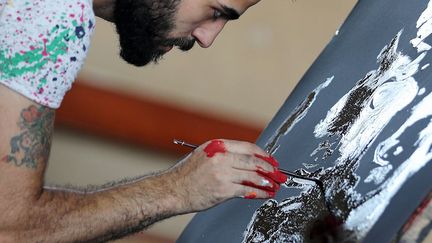 est un artiste de 23 ans dont le nom commence à émerger sur la scène artistique cairote.
 
 (Mohamed Abd el-Ghany / Reuters)