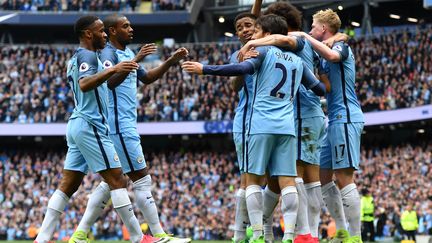 La joie des joueurs de Manchester City (ANTHONY DEVLIN / AFP)