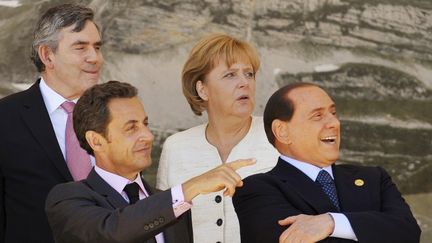 Gordon Brown, Nicolas Sarkozy, Angela Merkel et Silvio Berlusconi lors d'une r&eacute;union du G8 &agrave; L'Aquila (Italie), le 9 juillet 2009. (MICHAEL GOTTSCHALK / DDP)