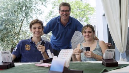 Baptiste, François et Sarah Combescure (de gauche à droite). (ROMAIN LAFABREGUE / AFP)