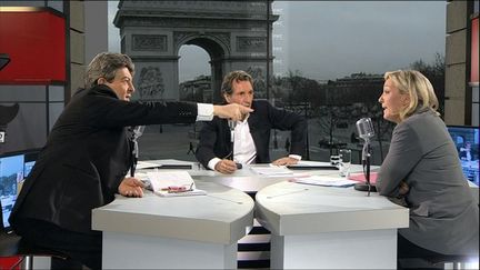 Jean-Luc M&eacute;lenchon (&agrave; g.) et Marine Le Pen (&agrave; d.)&nbsp;ont d&eacute;j&agrave; d&eacute;battu sur le plateau de BFMTV le 14 f&eacute;vrier 2011, dans l'&eacute;mission de Jean-Jacques Bourdin. (BFMTV / AFP)