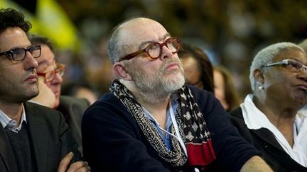 Le couturier Christian Lacroix (C), l'actrice Firmine Richard et Mohamed Ulad-Mohand, lors du meeting de François Hollande au Bourget en janvier (AFP PHOTO POOL FRED DUFOUR)