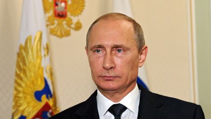 Le pr&eacute;sident russe Vladimir Poutine &agrave; Moscou le 21 juillet 2014.est sous le feu des critiques depuis plusieurs jours, alors que la Russie est accus&eacute;e d'avoir fourni aux s&eacute;paratistes le missile qui aurait caus&eacute; le crash du vol MH17. (MIKHAIL KLIMENTYEV / RIA-NOVOSTI / AFP)