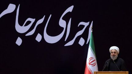 Le président iranien Hassan Rohani, le 19 janvier 2016, lors d'une conférence sur le thème «l'application de l'accord sur le plan d'action, un nouveau chapitre de l'économie de l'Iran». (STRINGER / IRANIAN PRESIDENCY / AFP)