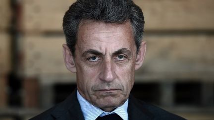 Nicolas Sarkozy a été mis en examen et placé sous contrôle judiciaire mercredi 21 mars à l'issue de sa garde à vue dans le cadre de l'enquête sur l'éventuel financement libyen de la campagne présidentielle de 2007.&nbsp; (FREDERICK FLORIN / AFP)