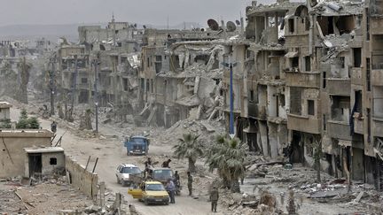 La ville de&nbsp;Hajar al-Aswad (Syrie) en ruines, le 22 mai 2018. (LOUAI BESHARA / AFP)