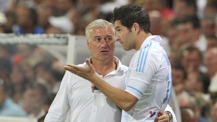 Andr&eacute;-Pierre Gignac (&agrave; droite) et Didier Deschamps pendant le match OM-Saint-Etienne le 21 ao&ucirc;t 2011 au Stade-V&eacute;lodrome de Marseille (Bouches-du-Rh&ocirc;ne). (BORIS HORVAT / AFP)