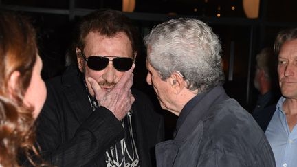 Johnny Hallyday et Claude Lelouch, le 24 avril 2017. (ROBYN BECK / AFP)