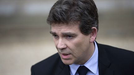 Le ministre du Redressement productif, Arnaud Montebourg, mercredi 3 juillet, &agrave; la sortie du Conseil des ministres. (FRED DUFOUR / AFP)