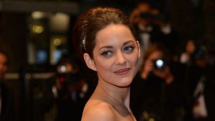 Marion Cotillard, chignon boule
 (AFP PHOTO / ALBERTO PIZZOLI)