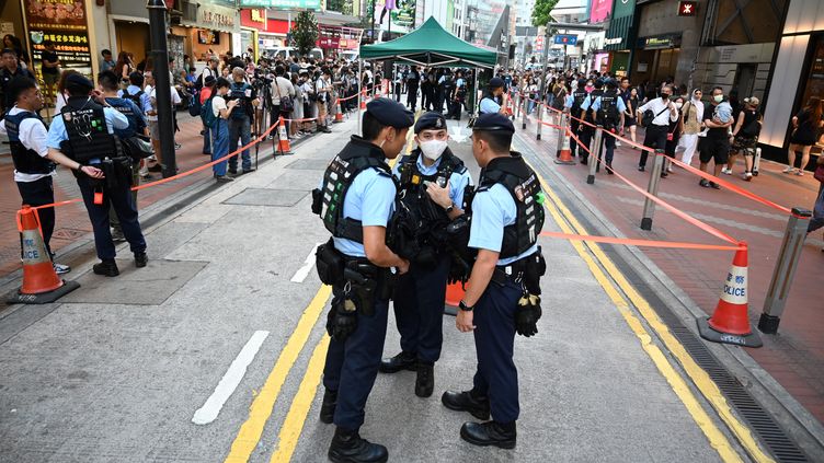 Police patrol in Causeway Bay, Hong Kong, on Tiananmen Commemoration Day, June 4, 2023. (PETER PARKS / AFP)