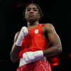 La boxeuse Cindy Ngamba, première médaillée de l'histoire de l'équipe olympique des réfugiés, après sa qualification en demi-finales des JO à l'Arena Paris Nord, le 4 août 2024. (MOHD RASFAN / AFP)