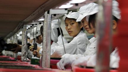 Avec 40% des votes, vous avez choisi notre enqu&ecirc;te sur les conditions de travail dans les usines de fabrication de smartphones en Chine. (© BOBBY YIP / REUTERS / X00306)