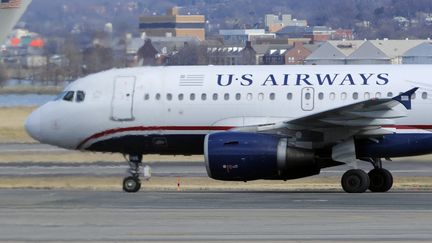 Une passag&egrave;re a &eacute;t&eacute; expuls&eacute;e d'un vol Us Airways dans le Connecticut, mercredi 26 novembre, apr&egrave;s avoir tent&eacute; de voyager avec son cochon. (MIKE THEILER / REUTERS)