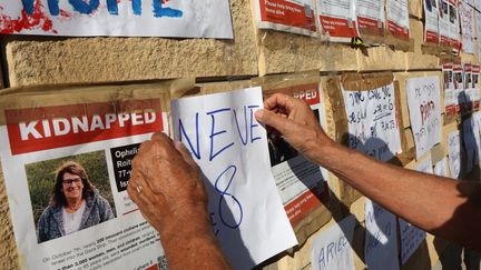 Relatives of Israeli hostages kidnapped by Hamas demonstrate in front of the Israeli HaKirya military base, in central Tel Aviv, October 14, 2023. (GIL COHEN-MAGEN / AFP)