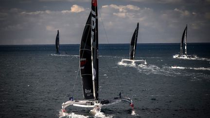 Le skipper français Anthony Marchand sur son multicoque Actual Ultim après le départ de l'Arkéa Ultim Challenge, une course autour du monde en solitaire en multicoque, au large de Brest, à l'ouest de la France, le 7 janvier 2024. (LOIC VENANCE / AFP)