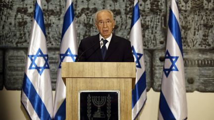 "Arik (diminutif d'Ariel) &eacute;tait un soldat courageux et un dirigeant audacieux qui aimait sa nation et que sa nation aimait", a d&eacute;clar&eacute; le pr&eacute;sident isra&eacute;lien&nbsp;Shimon Peres. (GALI TIBBON / AFP)