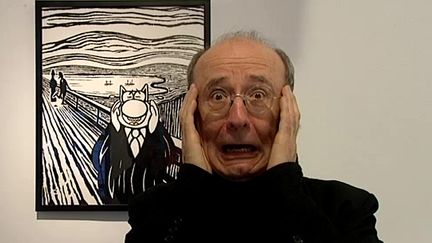 Philippe Geluck s'amuse à imiter le chat imitant lui même le Cri de Munch 
 (France Télévisions/culturebox )