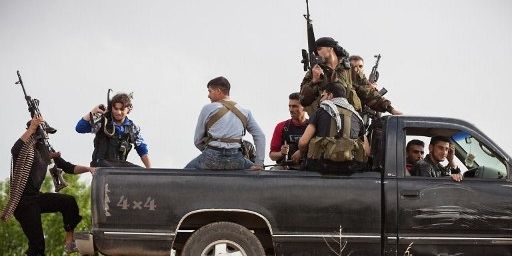 Membres d'un "commando brigade" de l'Armée syrienne libre, groupe d'opposition armée, à Qusayr (15 km de Homs), le 10 mai 2012 (AFP - STR )