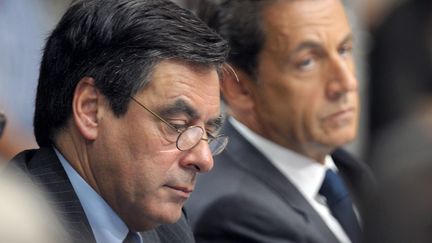 Le Premier ministre Fran&ccedil;ois Fillon et le pr&eacute;sident Nicolas Sarkozy, le 28 juin 2011 &agrave; Sabl&eacute;-sur-Sarthe (Sarthe). (PHILIPPE WOJAZER /&nbsp;AFP PHOTO)