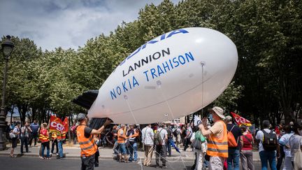 Manifestation aux Invalides, à Paris, contre&nbsp;les suppressions de postes chez Nokia en France,&nbsp;le 8 juillet 2020.







 (JEAN-FRANÇOIS FERNANDEZ / RADIO FRANCE)