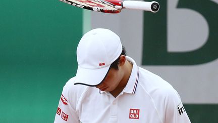 Le Japonais&nbsp;Kei Nishikori s'&eacute;nerve apr&egrave;s avoir rat&eacute; un point lors de son match face au Slovaque&nbsp;Martin Klizan au premier tour du tournoi de tennis de Roland-Garros &agrave; Paris, le 26 mai 2014. (PATRICK KOVARIK / AFP)