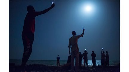 Cette image de migrants au clair de lune gagne le World Press Photo
 (John Stanmeyer ANP/AFP)