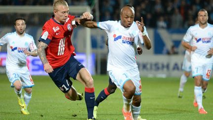 Simon Kjaer (Lille) et André Ayew (Marseille). 