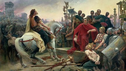 Vercingetorix jette ses armes aux pieds de Jules César, peinture deLionel Royer, 1899. (Musée Crozatier du Puy-en-Velay.)