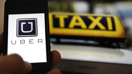 &nbsp; (Uber est présent sur internet ou via des applications pour téléphone portable. Photo d'illustration © REUTERS/Kai Pfaffenbach)