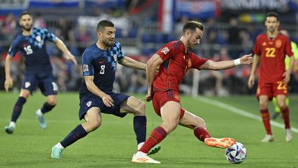 Croatian Mateo Kovacic (left) against Spaniard Fabian Ruiz in the Nations League final, in Rotterdam (Netherlands), June 18, 2023. (JOHN THYS / AFP)