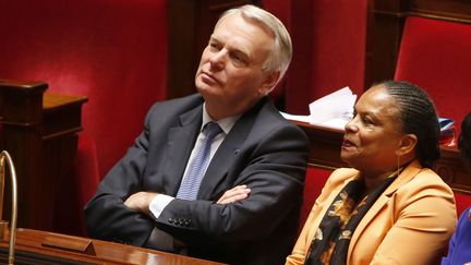 Jean-Marc Ayrault et Christiane Taubira, &agrave; l'Assembl&eacute;e nationale, lors du vote de la loi autorisant le mariage des couples de m&ecirc;me sexe, le 23 avril 2013. (CHARLES PLATIAU / REUTERS)