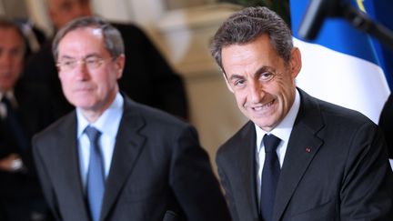 Claude Guéant et Nicolas Sarkozy, le 13 avril 2012 à Ajaccio (Corse-du-Sud). (PASCAL POCHARD CASABIANCA / AFP)