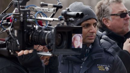 M. Night Shyamalan sur le tournage de "The Visit", son nouveau film, qui sort mercredi 7 octobre en France. (JOHN BAER / AP / SIPA)