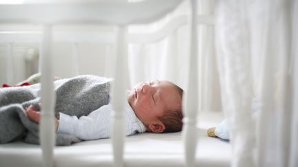 For the first year of life, a baby should be placed on his or her back only, on a firm mattress that fits a crib, and without any pillows, comforters, duvets, baby wedges or mattress toppers. (Illustration) (CATHERINE DELAHAYE / STONE RF / GETTY IMAGES)