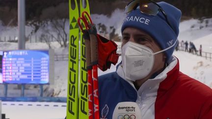 Quentin Fillon Maillet laisse parler son émotion au micro de France Télévisions après son titre olympique en biathlon, sur l'individuel, à Pékin, le 8 février 2022. (France 3)