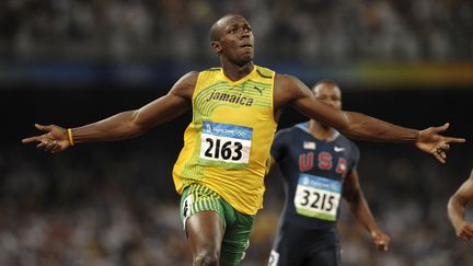 Usain Bolt après sa victoire sur 100m aux Jeux Olympiques de Pékin (OLIVIER MORIN / AFP)