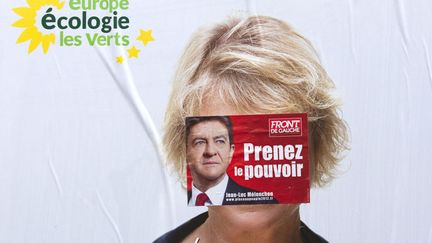 Affiche de campagne de la candidate d'EELV masqu&eacute;e par une affichette du candidat du Front de Gauche, Jean-Luc M&eacute;lenchon&nbsp;&agrave; Paris, le 9 avril 2012. (JOEL SAGET / AFP)