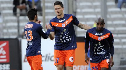 Le Montpelli&eacute;rain Olivier Giroud (au centre) apr&egrave;s son but contre l'OM, le 11 avril 2012 au stade V&eacute;lodrome de Marseille. (BORIS HORVAT / AFP)