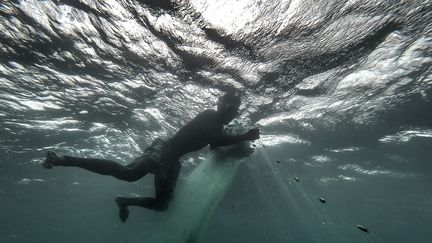 "Il n'y a tout simplement plus assez de poissons pour nourrir tout le monde", constate Fulgence, qui rejette l’accord de pêche avec la Chine. (ANTOINE DEMAISON / AFP)